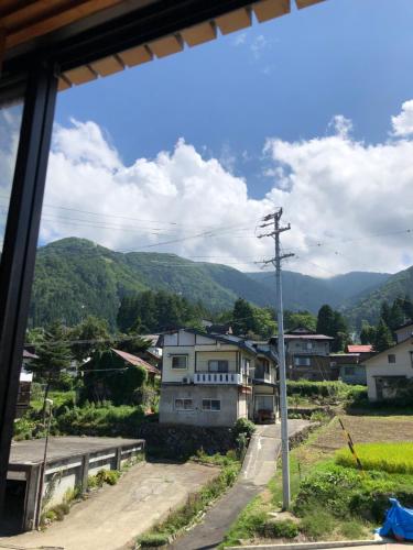 a view of a village from the window of a house at Apartment at Toemu Nozawa in Nozawa Onsen