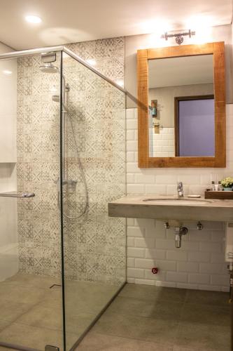 a bathroom with a shower and a sink at Royale Parc Hotel Tagaytay in Tagaytay