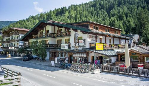 a large building on the side of a road at Hotel Mitterhof in Gerlos