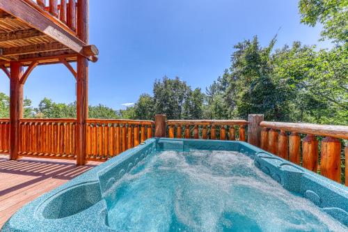 a hot tub on the deck of a house at Million Dollar View Cabin in Dupont Springs