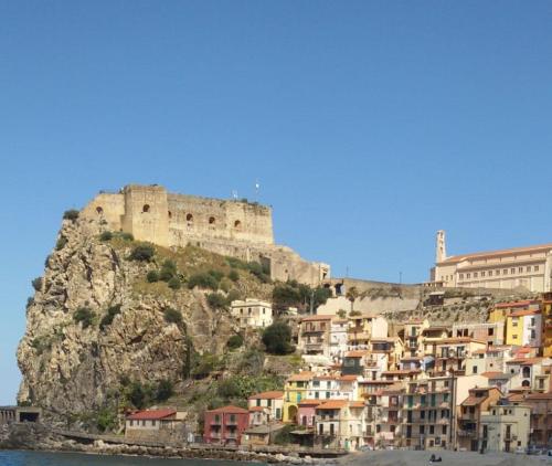 a town on a hill with a castle on top at Antico Vicolo in Scilla
