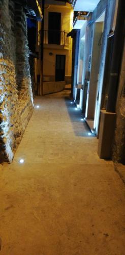 an empty alleyway with lights on the side of a building at Antico Vicolo in Scilla