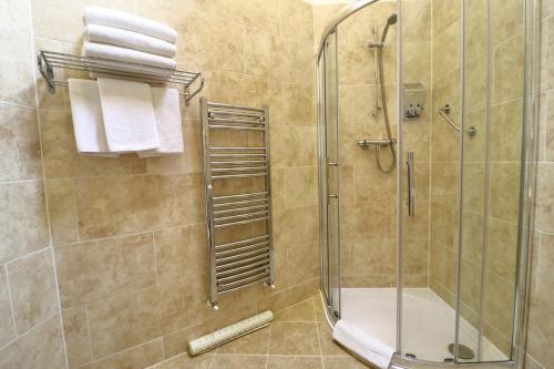 a bathroom with a shower and a glass shower stall at Westlands of Pitlochry in Pitlochry
