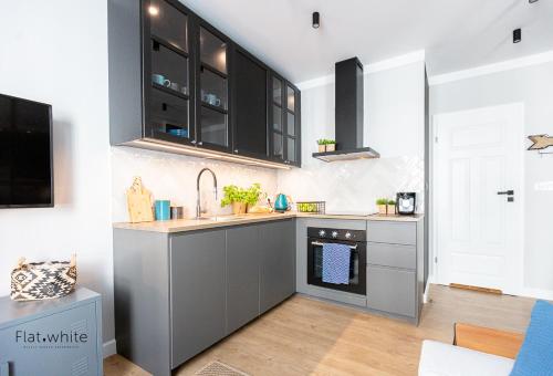 Dapur atau dapur kecil di Apartamenty Flat White Obywatelska 47AB