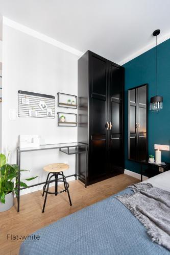 Katil atau katil-katil dalam bilik di Apartamenty Flat White Obywatelska 47AB