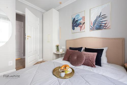Katil atau katil-katil dalam bilik di Apartamenty Flat White Obywatelska 47AB