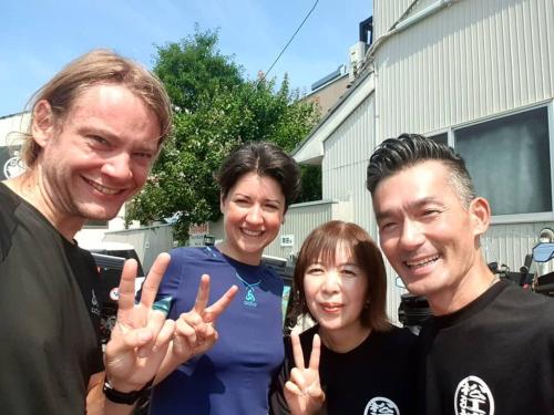 a group of three people giving the peace sign at Guest house daisho oshiro asobi in Matsue