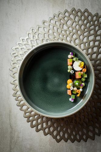 a bowl of food sitting on a metal table at Das Homann in Samnaun