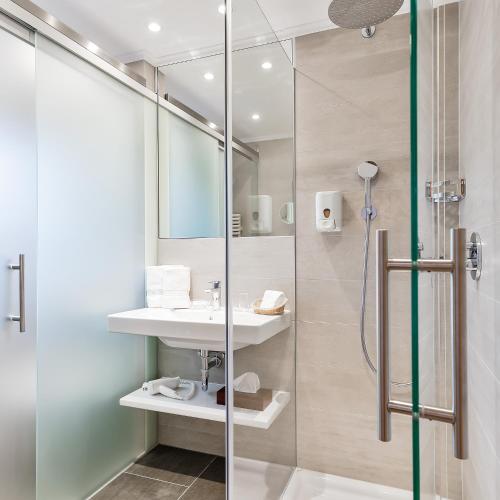 a bathroom with a shower and a sink at Das Homann in Samnaun