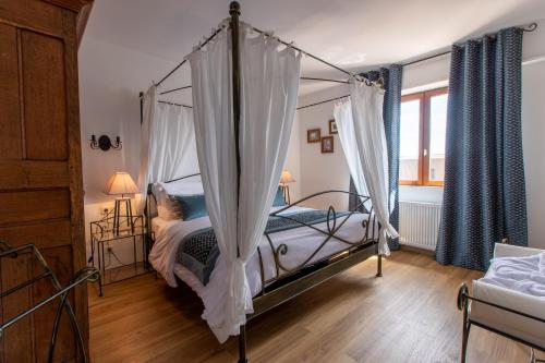 Voodi või voodid majutusasutuse Le Panoramic & Spa toas