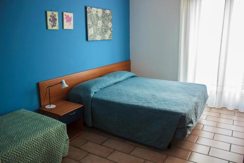 Postel nebo postele na pokoji v ubytování Villa Ruberto