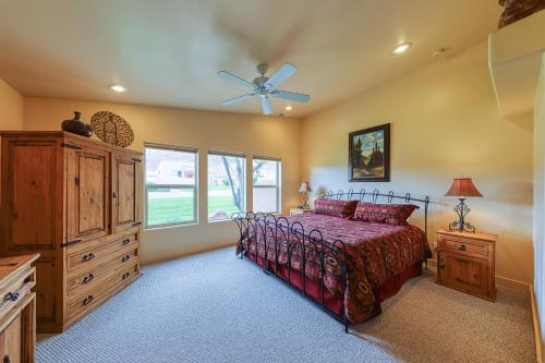 a bedroom with a bed and a dresser at Rim Village T2 in Moab