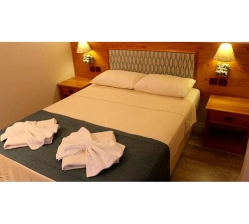 Una cama o camas en una habitación de Yelken Hotel Akyaka