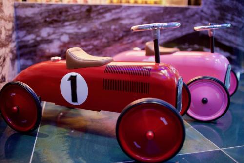 a red toy car sitting on top of a table at Norway Forest Travel hotel 1 Taichung in Taichung