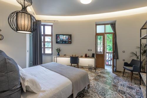 Postel nebo postele na pokoji v ubytování Casa Poli Suites
