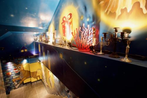 a shelf with candles and lights on a wall at Norway Forest Travel hotel 1 Taichung in Taichung