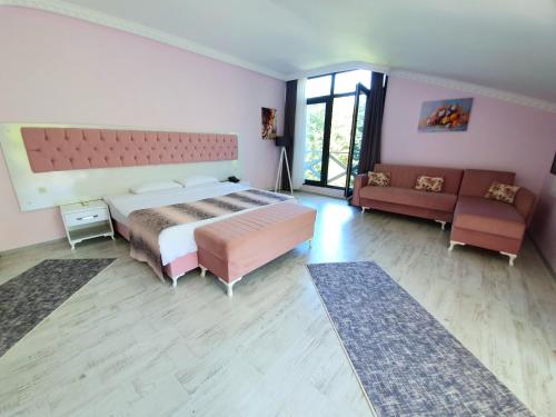 Katil atau katil-katil dalam bilik di Kadifeli Konak Hotel & Bungalow