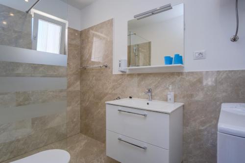 Kúpeľňa v ubytovaní Apartmani Beatrice