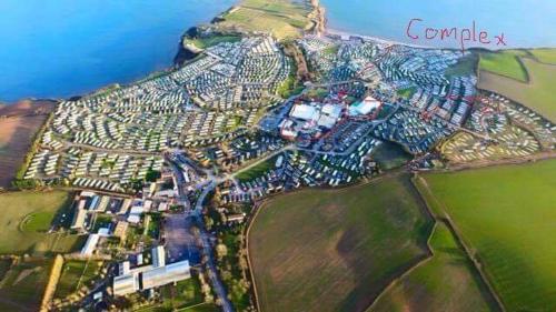 an aerial view of a city on top of a mountain at Devon Cliffs in Exmouth