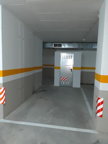 an empty room with a door in a building at PISO EN 1ª LINEA DE PLAYA CON WIFI PUERTO DE CARIÑo in Cariño