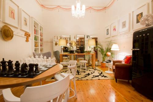 a living room with a chess board on a table at Casa Oliver Boutique B&B - Principe Real in Lisbon