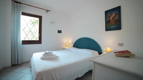 Ένα ή περισσότερα κρεβάτια σε δωμάτιο στο Le Residenze Di Sant'Elmo