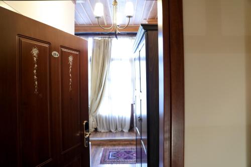 an open door to a room with a window at Boutique Hotel Palea Poli in Naousa Imathias