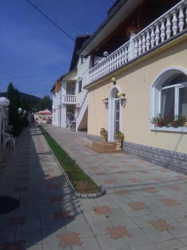 a house with stars on the ground in front of it at CAZARE LA ESPAÑOLA in Haţeg