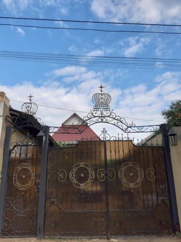 a gate with a cross on top of it at Смарт квартира in Odesa
