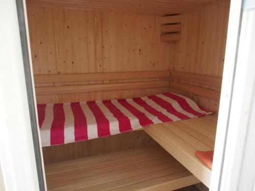 a sauna with a bed in the inside of it at Casa Branca in Covas