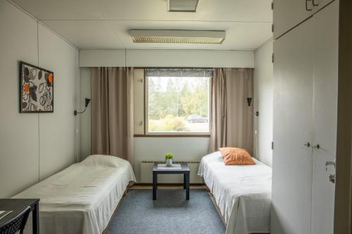 Säng eller sängar i ett rum på Hostel Jailhouse Hamina