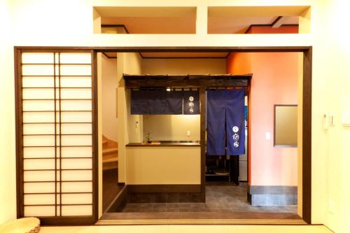 a view of a room with a sliding glass door at YADOYA Asakusa-Honkan in Tokyo