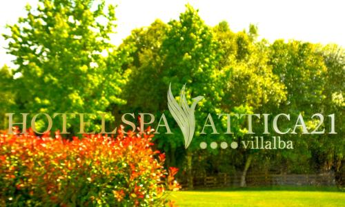 a sign for the hotel spa antigua in front of trees at Hotel Spa Attica21 Vilalba in Villalba