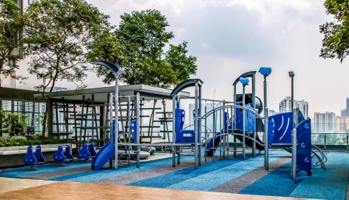 a playground with blue equipment in a park at 2 Bedroom 2 BATHROOM NEAR SUMWAY PYRAMID in Subang Jaya