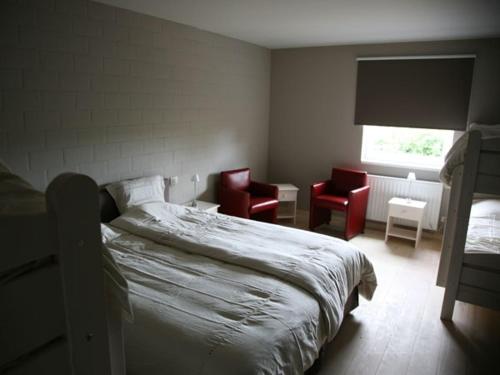 מיטה או מיטות בחדר ב-Bloesemhof