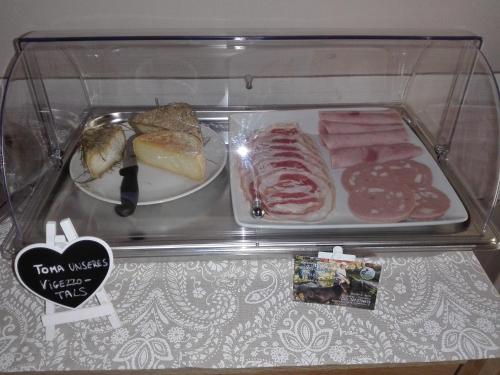 a plastic container filled with different types of food at eden in Cannobio