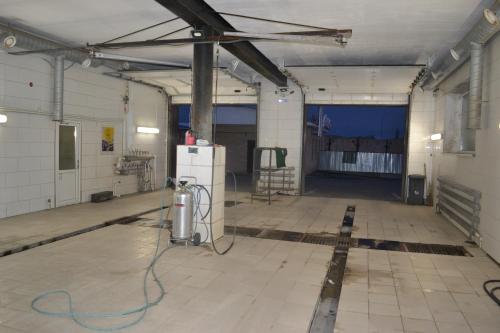 a large room with ailed floor in a building at Ayhan Hotel in Aktobe