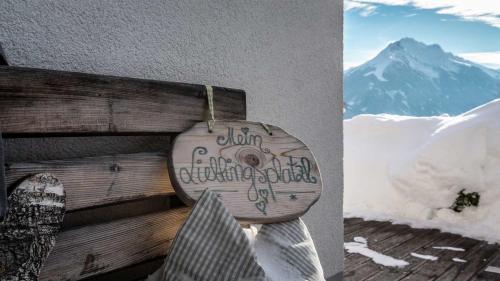 a toilet with writing on the side of a mountain at Stubaier Bauern Appartement in Telfes im Stubai
