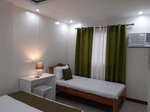 Cama o camas de una habitación en J and C Residences