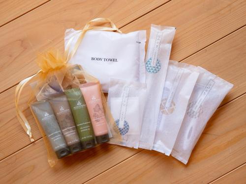 two bags of soap and candles on a table at 内子の宿 久 in Uchiko