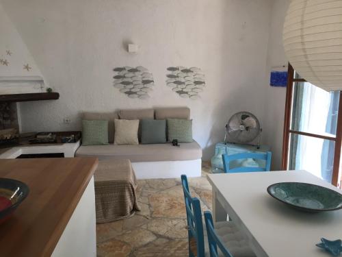 a living room with a couch and a table at Alexandra villas in Gouvia