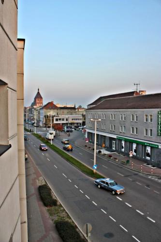 a view of a city street with cars on the road at Apartamenty Centrum in Koszalin