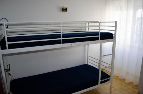 a couple of bunk beds in a room at Casa Vitorino in Sagres