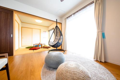 a living room with a hammock in the middle of a room at ID-STAY Kawaguchiko Ⅱ in Fujikawaguchiko
