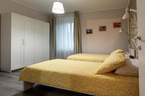 Postel nebo postele na pokoji v ubytování Le quattro stagioni - Terrazza Panoramica