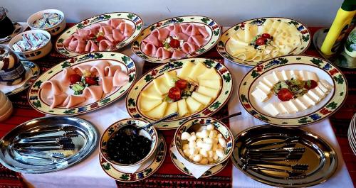 a bunch of plates of food on a table at Crama Haiducilor in Cluj-Napoca