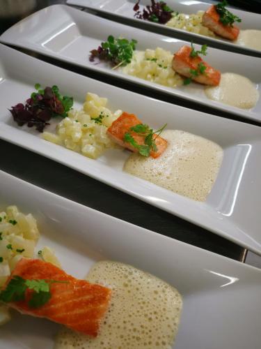 a row of plates with different types of food at Hotel Astoria in Samnaun