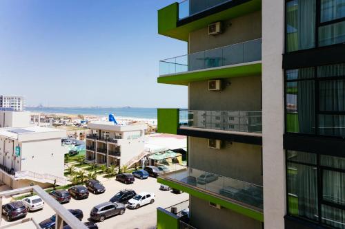 an aerial view of a building with a parking lot at Alezzi Beach Resort in Mamaia Nord