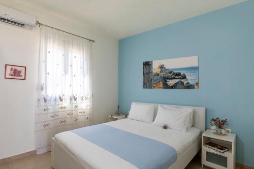 A bed or beds in a room at House Myrtos