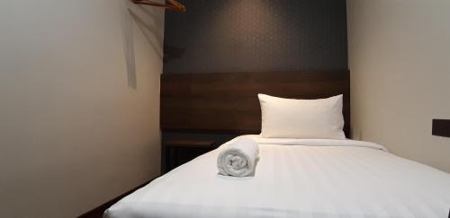 Ένα ή περισσότερα κρεβάτια σε δωμάτιο στο MIICO Hotel @ Mount Austin